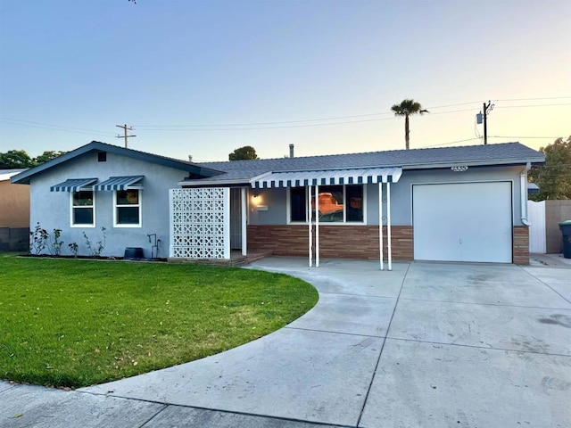 1335 S Hickory St, Anaheim, CA 92805 - single story home featuring a garage, a front lawn, driveway, and a shingled roof