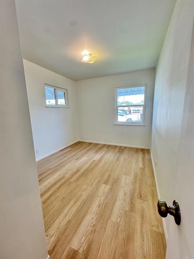 1335 S Hickory St, Anaheim, CA 92805 - unfurnished room with light wood-style floors and baseboards