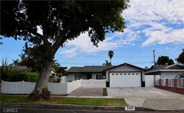 2309 W Anahurst Pl, Santa Ana, CA 92704 - ranch-style home with a garage, concrete driveway, and stucco siding