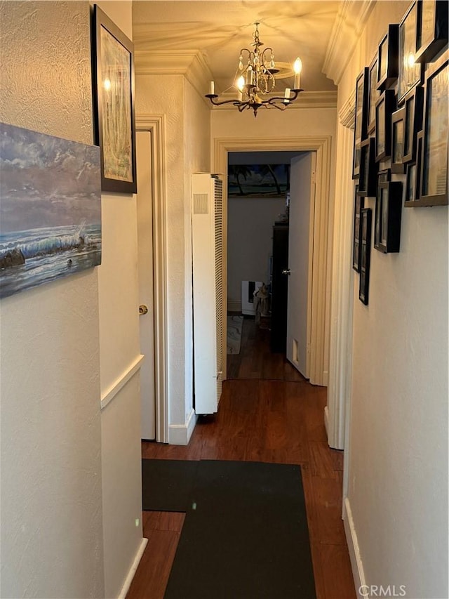 2309 W Anahurst Pl, Santa Ana, CA 92704 - corridor with a heating unit, a chandelier, ornamental molding, dark wood-type flooring, and baseboards