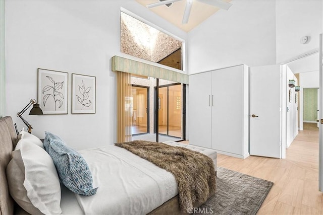 41810 Woodhaven Dr E, Palm Desert, CA 92211 - bedroom with a towering ceiling and light wood finished floors
