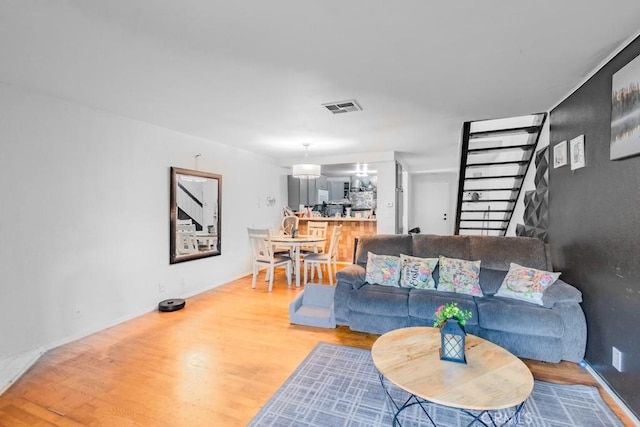 1052 W Ralston St, Ontario, CA 91762 - living room featuring wood finished floors and baseboards