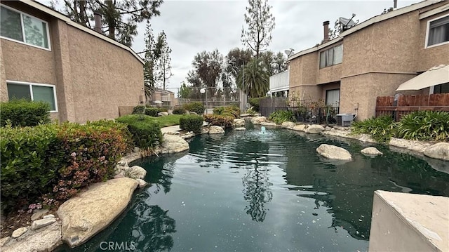 1052 W Ralston St, Ontario, CA 91762 - view of swimming pool featuring a small pond and central AC unit