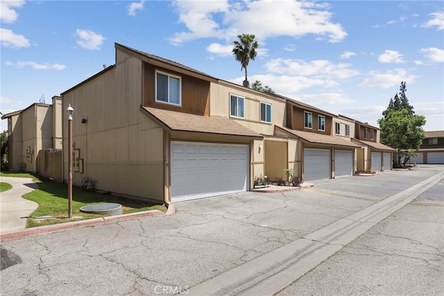 12828 Ramona Blvd Unit 54, Baldwin Park, CA 91706 - multi unit property with a residential view, a shingled roof, and driveway