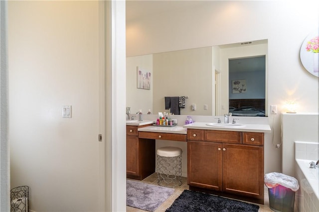 15345 Chive Ln, Fontana, CA 92336 - ensuite bathroom with vanity, a garden tub, and tile patterned flooring