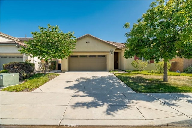15345 Chive Ln, Fontana, CA 92336 - view of front of property featuring a garage, stucco siding, driveway, a tile roof, and a front yard