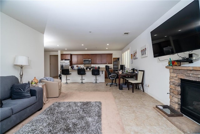 15345 Chive Ln, Fontana, CA 92336 - living room featuring a fireplace and recessed lighting