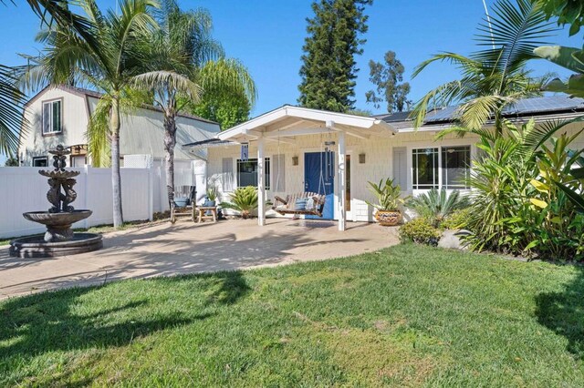 2042 Pheasant Run, Fallbrook, CA 92028 - back of property featuring roof mounted solar panels and a patio area
