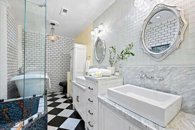 2042 Pheasant Run, Fallbrook, CA 92028 - full bathroom featuring tile walls, a shower stall, vanity, and tile patterned floors