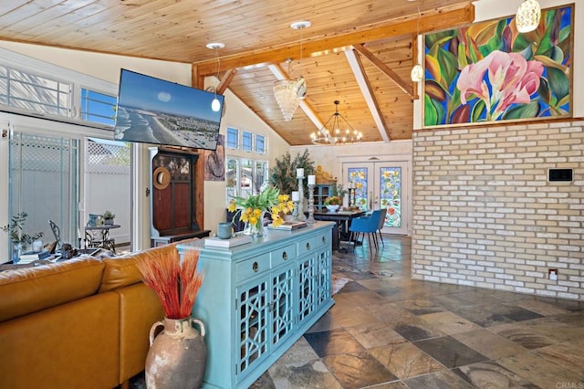 2042 Pheasant Run, Fallbrook, CA 92028 - living area featuring stone tile floors, a chandelier, french doors, a wooden ceiling with exposed beams, and brick wall