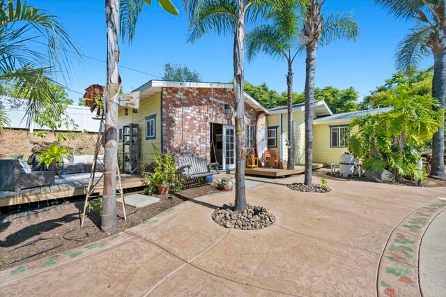 2042 Pheasant Run, Fallbrook, CA 92028 - back of house featuring a deck, a patio area, and brick siding