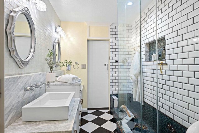 2042 Pheasant Run, Fallbrook, CA 92028 - full bath featuring a shower stall, double vanity, and tile walls