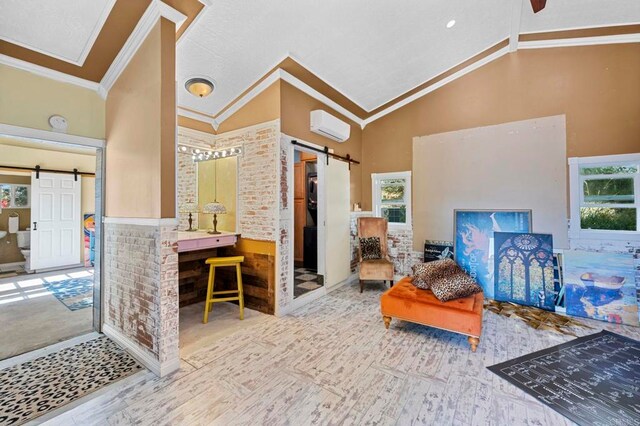 2042 Pheasant Run, Fallbrook, CA 92028 - living room with a barn door, ornamental molding, healthy amount of natural light, high vaulted ceiling, and a wall mounted AC