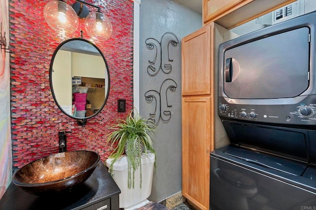 2042 Pheasant Run, Fallbrook, CA 92028 - washroom featuring estacked washer and dryer and cabinet space
