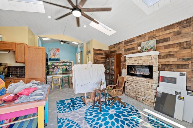 2042 Pheasant Run, Fallbrook, CA 92028 - living area featuring a skylight, a ceiling fan, vaulted ceiling, a fireplace, and concrete floors