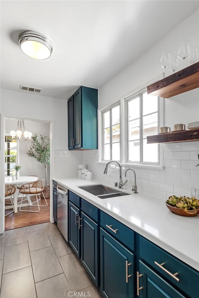 4146 Michael Ave, Los Angeles, CA 90066 - kitchen featuring a sink, blue cabinetry, light tile patterned floors, dishwasher, and backsplash