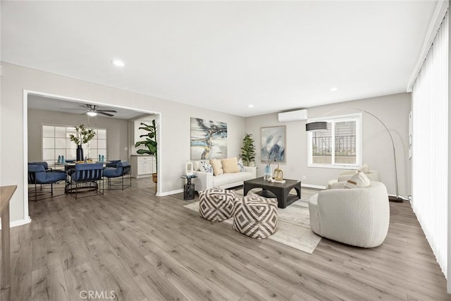 406 E Graves Ave, Monterey Park, CA 91755 - living area featuring a wall unit AC, baseboards, wood finished floors, and recessed lighting
