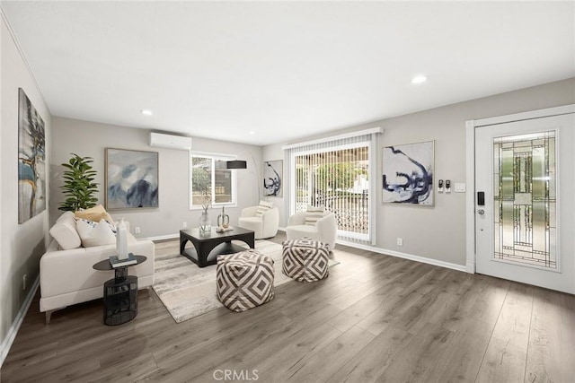 406 E Graves Ave, Monterey Park, CA 91755 - living area with a wall unit AC, wood finished floors, baseboards, and recessed lighting