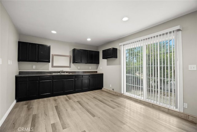 406 E Graves Ave, Monterey Park, CA 91755 - kitchen with dark cabinetry, light wood-style flooring, a sink, recessed lighting, and baseboards