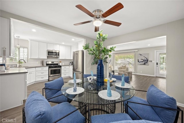 406 E Graves Ave, Monterey Park, CA 91755 - dining room with healthy amount of natural light, a ceiling fan, wood finished floors, recessed lighting, and baseboards