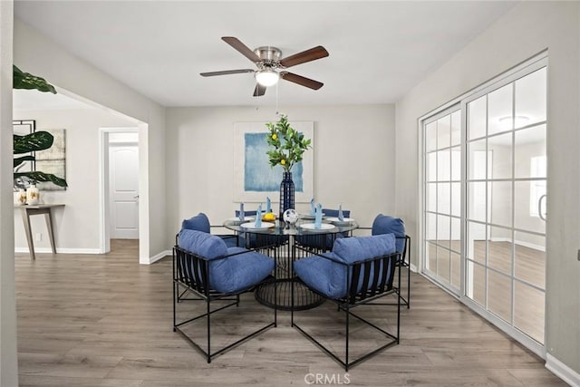 406 E Graves Ave, Monterey Park, CA 91755 - dining space with wood finished floors, a ceiling fan, and baseboards