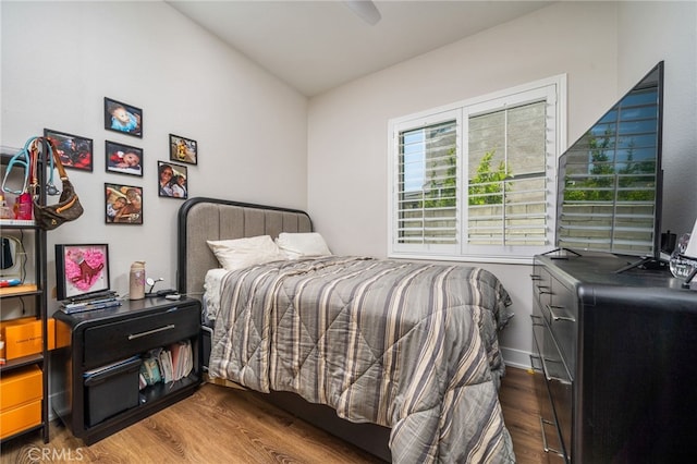 7256 Plumrose St, Fontana, CA 92336 - bedroom featuring wood finished floors, lofted ceiling, and a ceiling fan