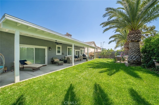 7256 Plumrose St, Fontana, CA 92336 - view of yard with a ceiling fan, a patio area, and an outdoor hangout area