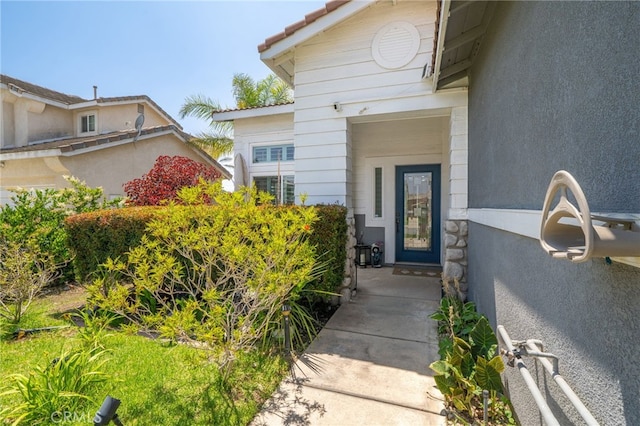 7256 Plumrose St, Fontana, CA 92336 - doorway to property featuring stucco siding