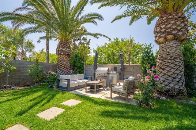 7256 Plumrose St, Fontana, CA 92336 - view of yard featuring exterior kitchen, a patio, and outdoor lounge area