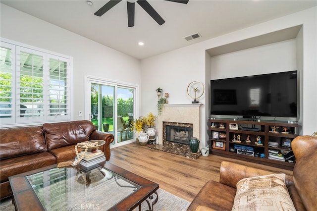 7256 Plumrose St, Fontana, CA 92336 - living area with a ceiling fan, a fireplace, wood finished floors, and recessed lighting