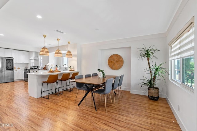 1015 Nolden St, Highland Park, CA 90042 - dining space with light wood-style floors and recessed lighting