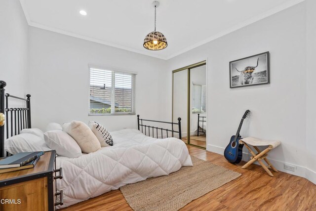 1015 Nolden St, Highland Park, CA 90042 - bedroom with a closet, wood finished floors, ornamental molding, and recessed lighting