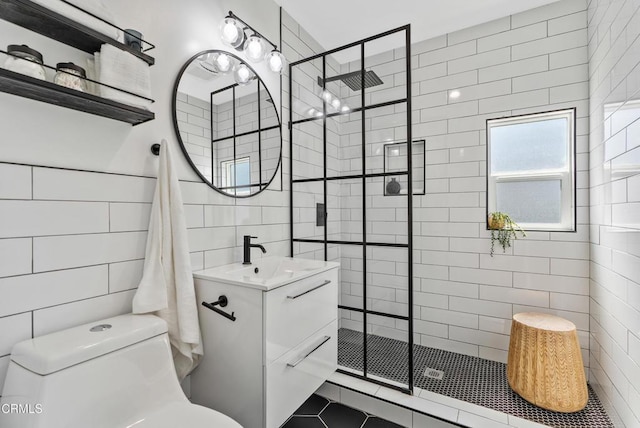 1015 Nolden St, Highland Park, CA 90042 - full bathroom featuring tile walls, a walk in shower, vanity, and tile patterned flooring