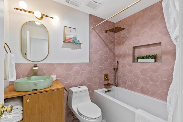 1015 Nolden St, Highland Park, CA 90042 - full bathroom with tile walls, shower / tub combo, and vanity