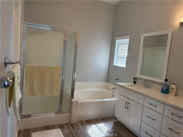861 Moyano Cir, Corona, CA 92882 - full bathroom featuring vanity, a bath, a shower stall, and wood finished floors