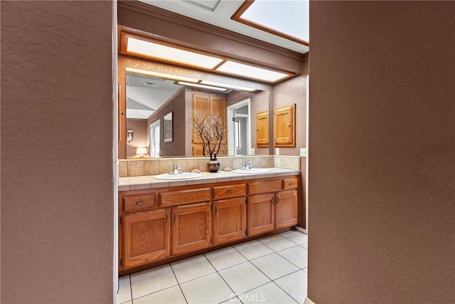 1555 Cordova Dr, San Luis Obispo, CA 93405 - bathroom with a textured wall, double vanity, and tile patterned flooring