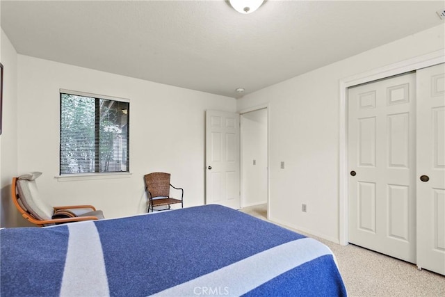 1555 Cordova Dr, San Luis Obispo, CA 93405 - bedroom with baseboards, light colored carpet, and a closet