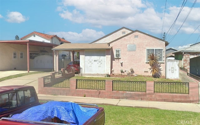 831 W 97th St, Los Angeles, CA 90044 - view of front of property featuring a fenced front yard, a gate, and an attached carport