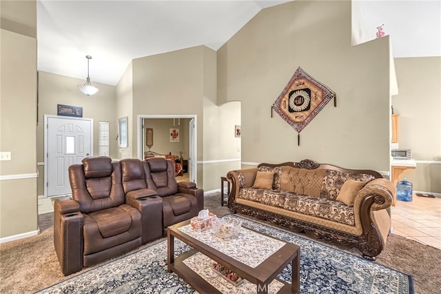 10033 N Baird Ave, Fresno, CA 93730 - carpeted living area featuring high vaulted ceiling and arched walkways