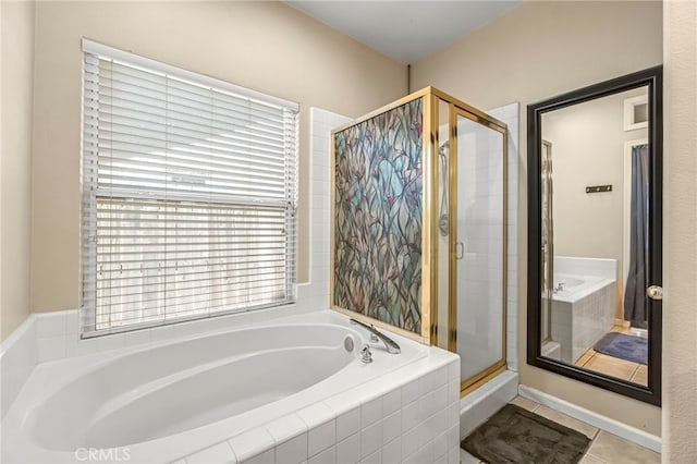 10033 N Baird Ave, Fresno, CA 93730 - bathroom with a bath, a stall shower, and tile patterned flooring