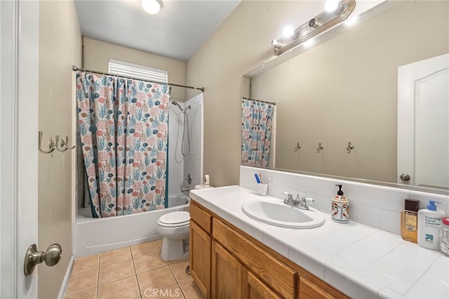 10033 N Baird Ave, Fresno, CA 93730 - bathroom featuring vanity, tile patterned floors, and shower / bath combo with shower curtain