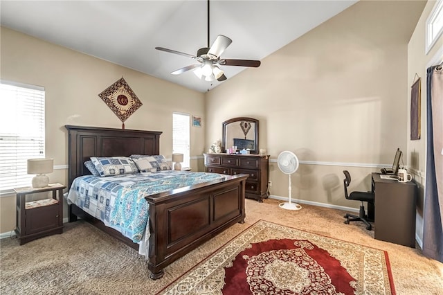 10033 N Baird Ave, Fresno, CA 93730 - bedroom featuring multiple windows, light carpet, vaulted ceiling, and ceiling fan