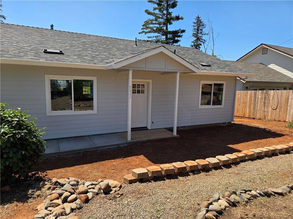 5821 Copeland Rd, Paradise, CA 95969 - view of front of house with a shingled roof and a patio area