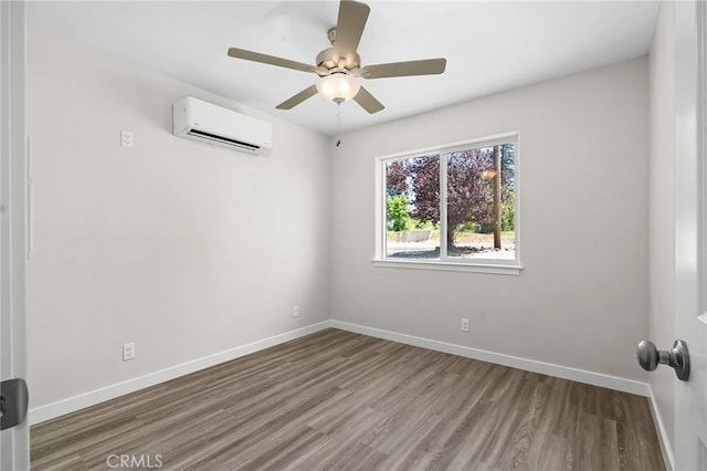 5821 Copeland Rd, Paradise, CA 95969 - empty room featuring wood finished floors, an AC wall unit, baseboards, and ceiling fan