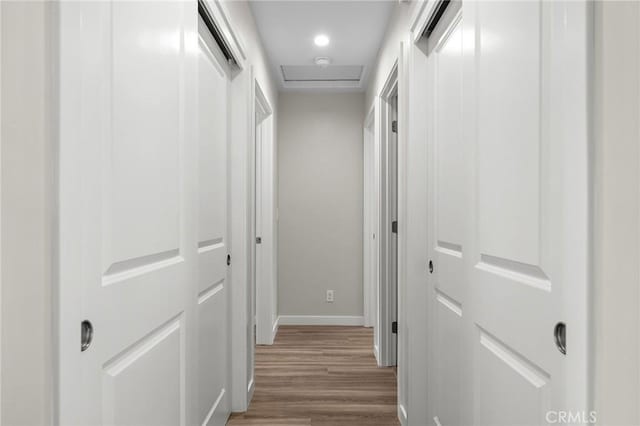 5821 Copeland Rd, Paradise, CA 95969 - hall with wood finished floors, baseboards, and attic access