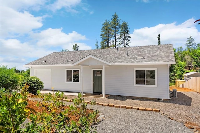 5821 Copeland Rd, Paradise, CA 95969 - ranch-style house featuring a garage, a shingled roof, and central AC