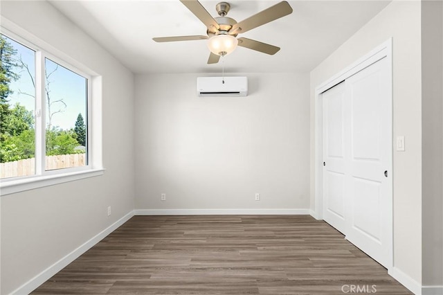 5821 Copeland Rd, Paradise, CA 95969 - unfurnished bedroom featuring a wall mounted air conditioner, wood finished floors, a closet, baseboards, and a ceiling fan