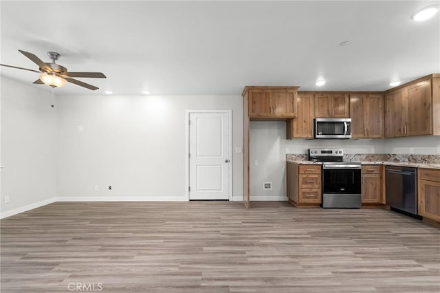 5821 Copeland Rd, Paradise, CA 95969 - kitchen with appliances with stainless steel finishes, recessed lighting, light wood finished floors, and brown cabinetry