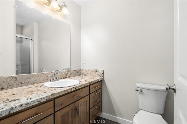 5821 Copeland Rd, Paradise, CA 95969 - bathroom with vanity, toilet, a stall shower, and baseboards