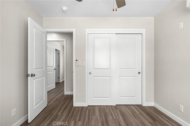 5821 Copeland Rd, Paradise, CA 95969 - unfurnished bedroom with dark wood-style floors, baseboards, a closet, and a ceiling fan